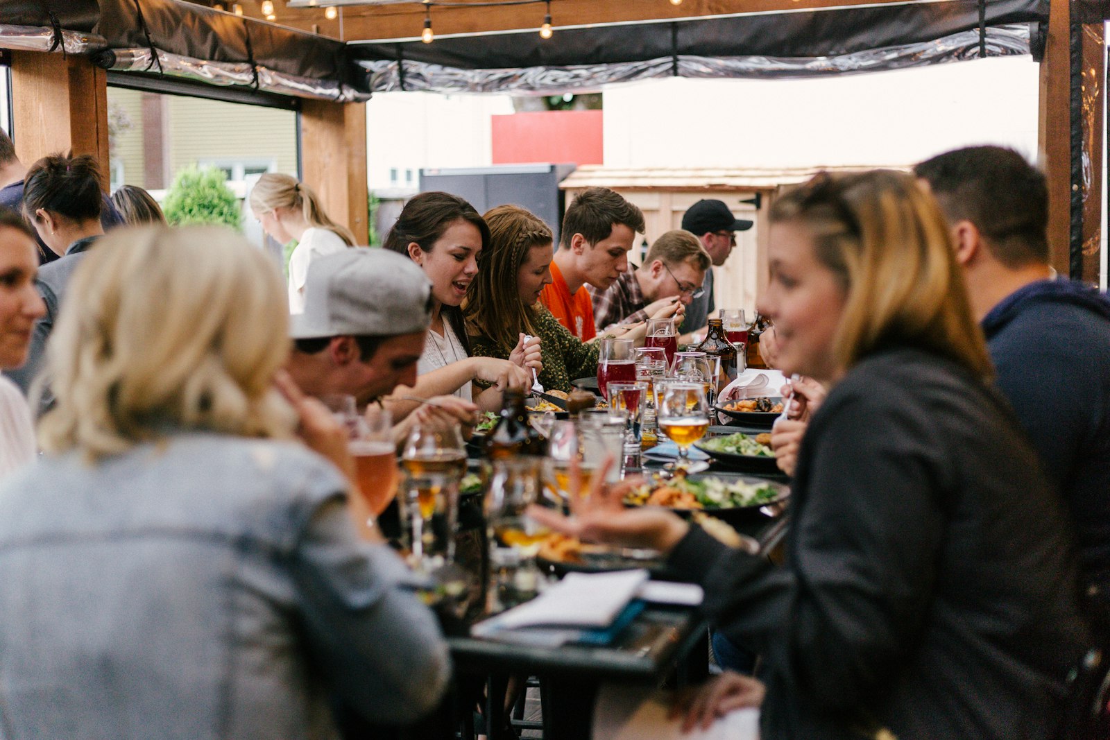 Bustling restaurant with servers moving between tables